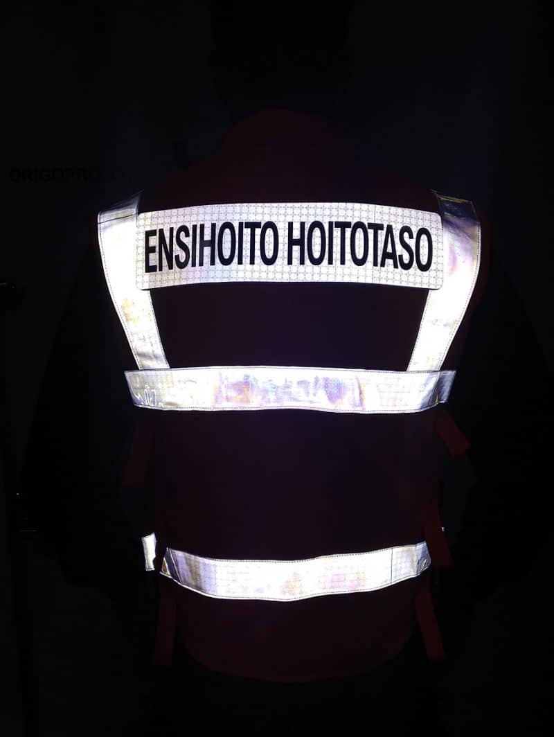 High visibility EN 20471 equipment vest reflection in dark